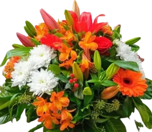 Bouquet de fleurs de deuil coloré avec lys orange, gerberas et chrysanthèmes.